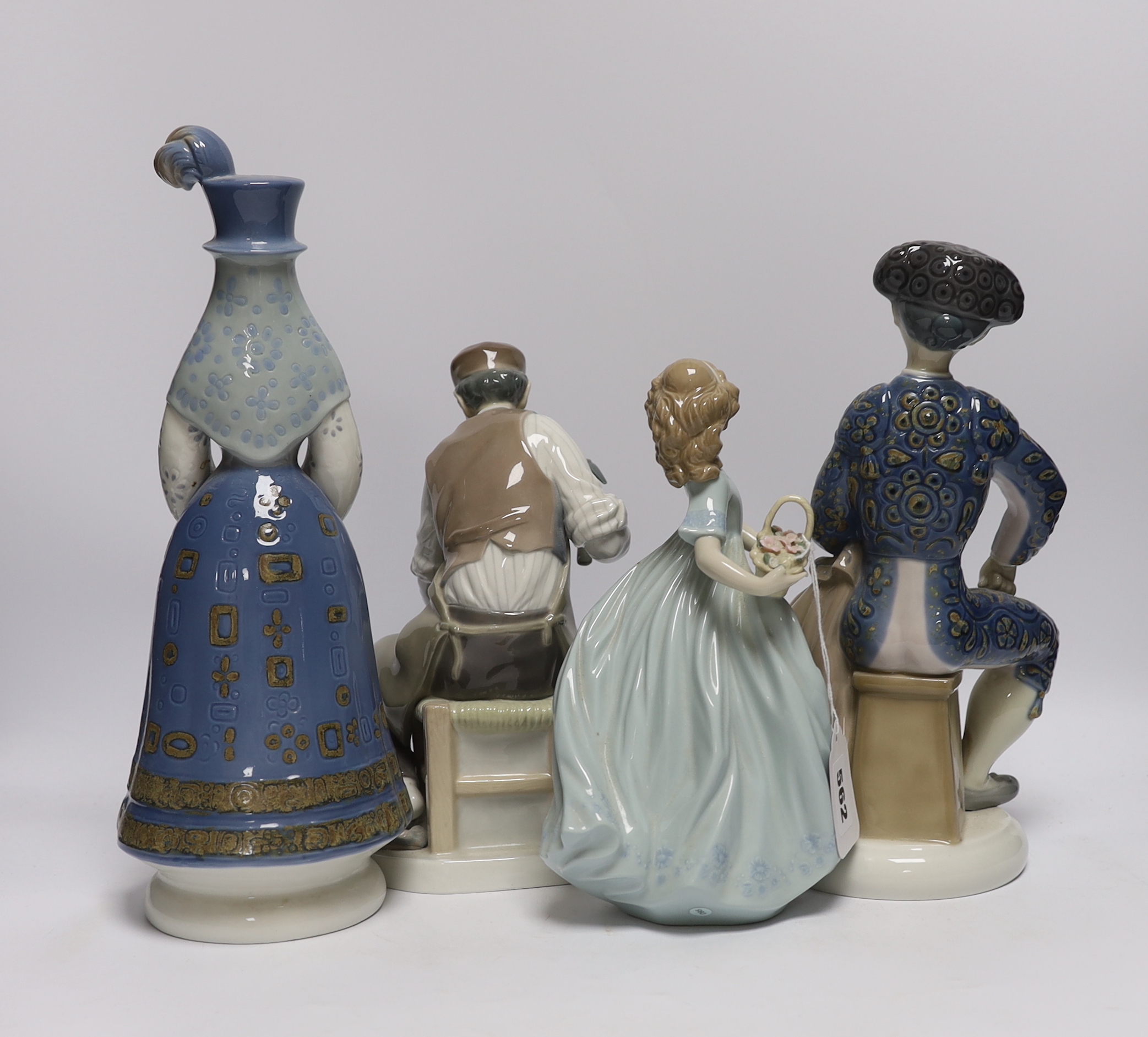 Four Lladro figures: a matador, two women and a cobbler, tallest 33cm